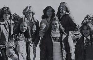 Group of smiling teenagers outdoors in winter clothing